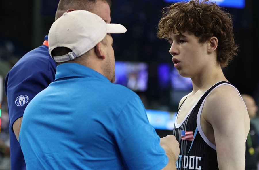 Coach and family discussing athlete referral pathway